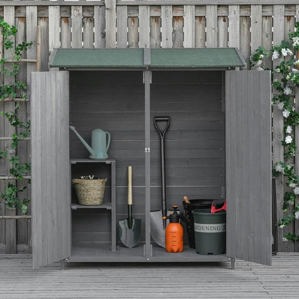 Grey wooden garden shed with double doors open showing interior shelving and tools
