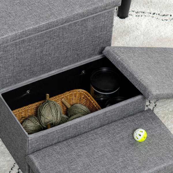 Light grey pet stairs close-up: open storage drawer with toys, yarn, and bowls