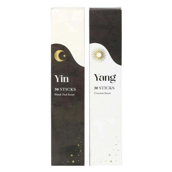 Two incense stick boxes with yin and yang symbols, 30 sticks each in black and white