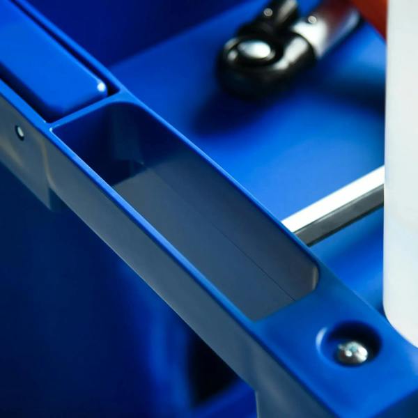 Close-up of blue trolley base rail with fastening bolt on the platform
