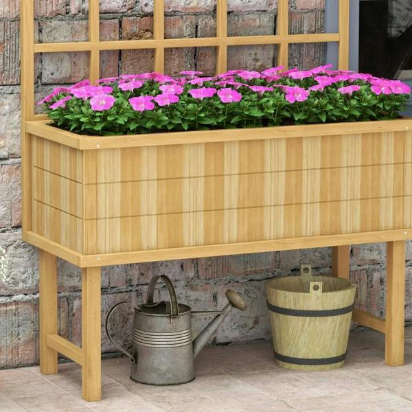 Natural wooden garden planter with trellis and raised bed, side view with pink flowers.