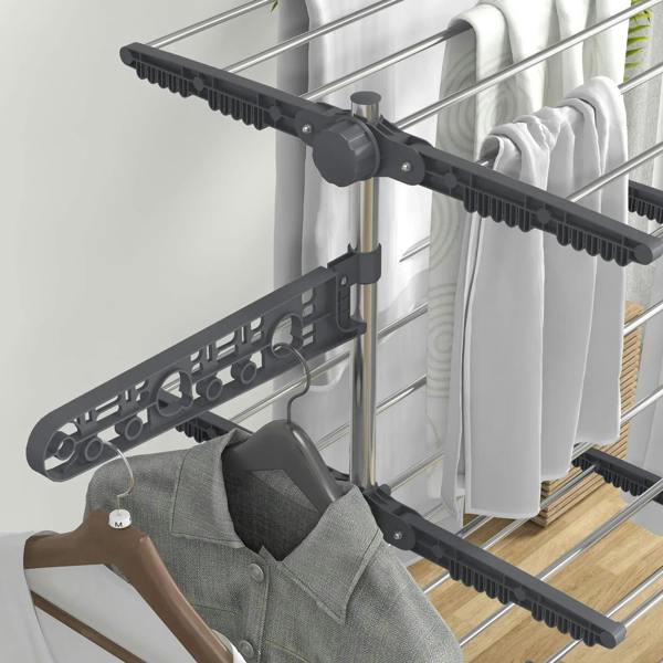Close-up of grey rotatable side wing on a four-tier clothes drying rack