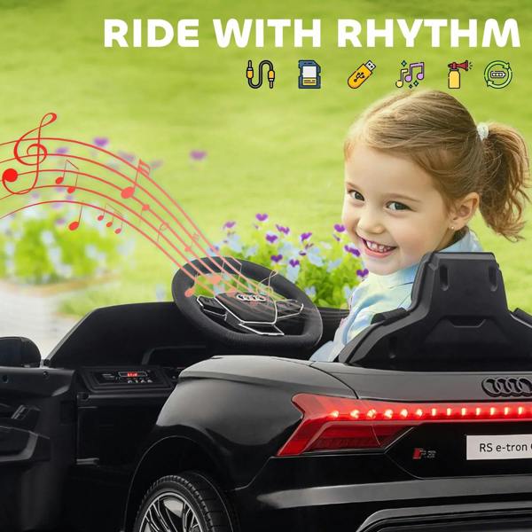 Black kids electric ride-on car with glowing taillights and steering wheel, rear view