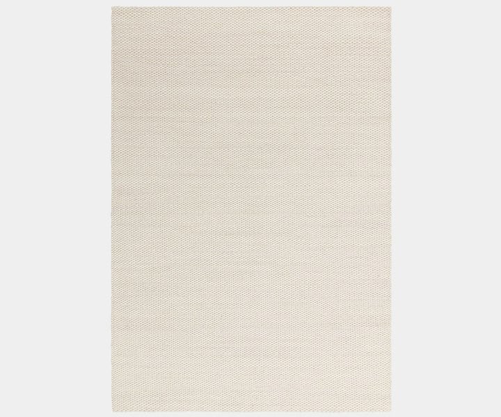 Zander Ivory luxury rug featuring a natural wave design for high-end home decor.