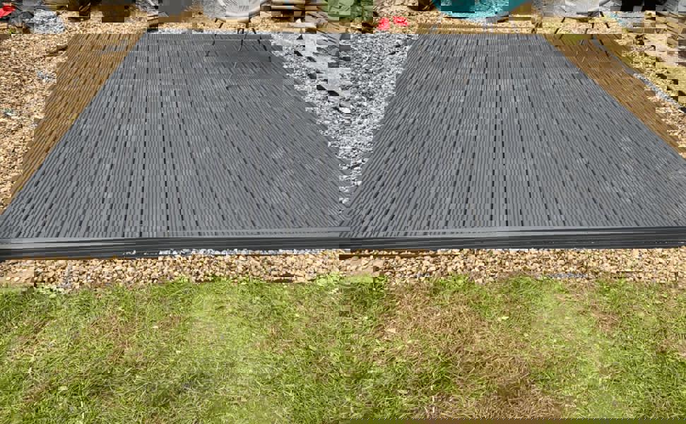 Gray composite deck on gravel