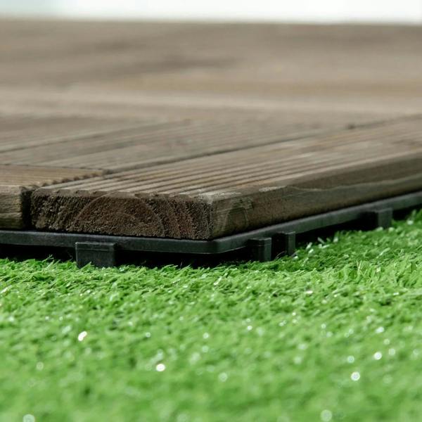 Close-up of charcoal grey decking tile top slats and black raised support feet