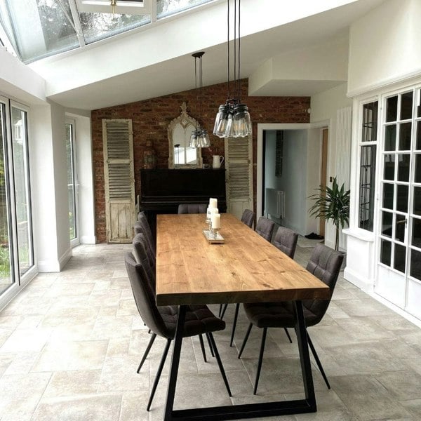 Driftwood bespoke rustic wood dining table with a chunky triangle frame