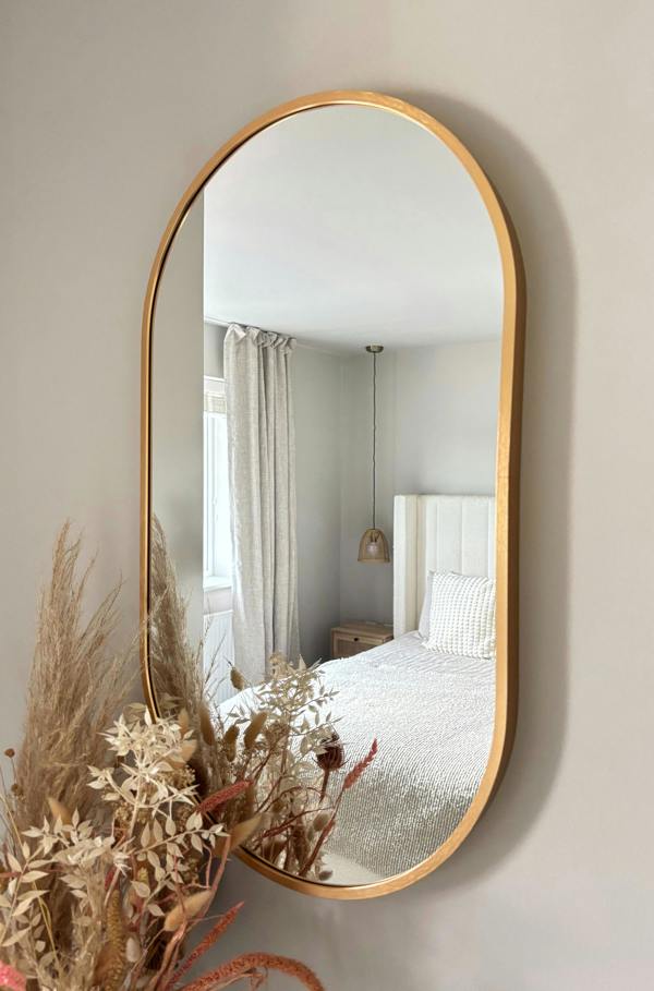 Downton Interiors Gold Modern Metal Frame Oval Wall Mirror - 70cm