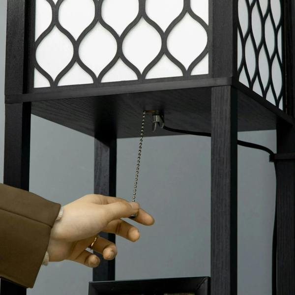 Black floor lamp with pull chain switch and open shelving beneath lattice panel lampshade.