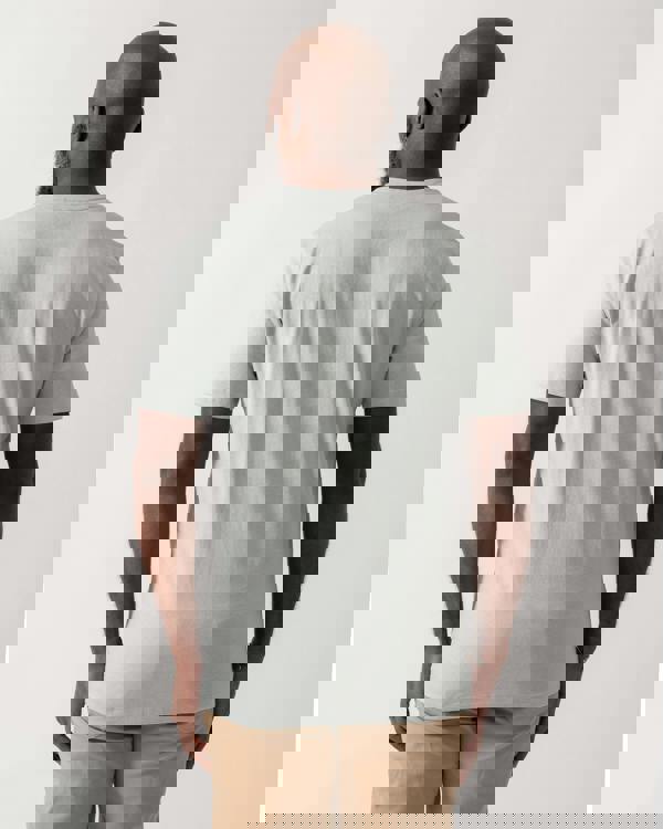 back shot of a model wearing a BOSS Orange Tales Mens Cotton-Jersey T-shirt With Logo Patch in Silver