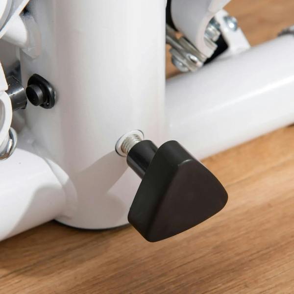 Twist stepper base adjustment knob with black rubber foot stabilizer on white frame