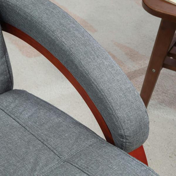 Grey upholstered recliner chair back and armrest with curved wooden frame detail
