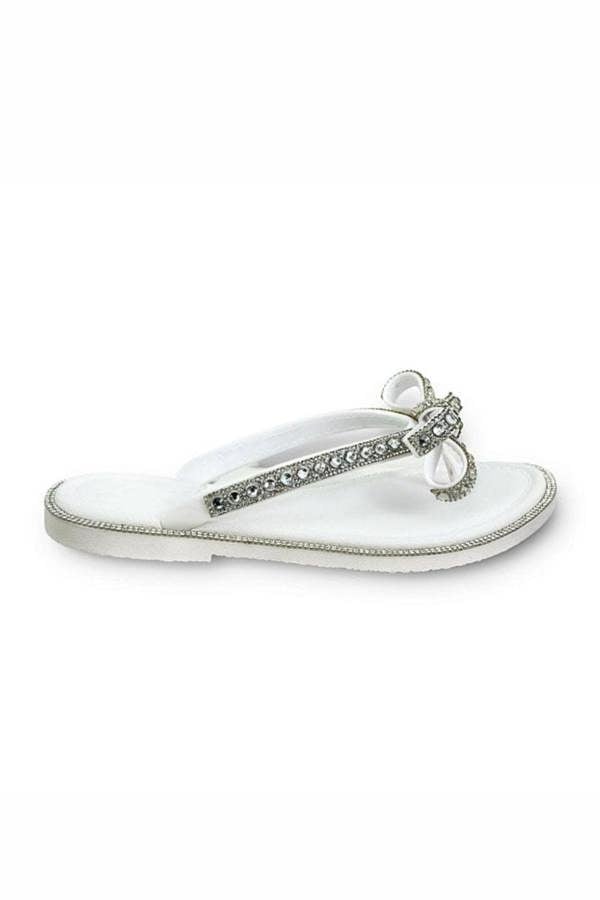 White embellished sparkly sandal against a white background