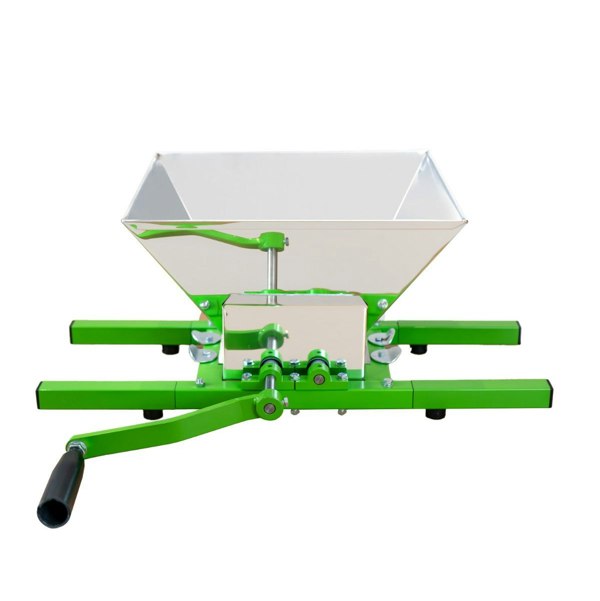 KuKoo fruit crusher with a shiny metal hopper, green metal frame, and a sturdy handle for easy fruit processing and juicing