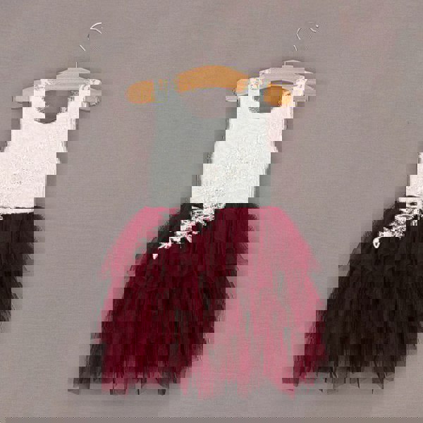 Deep red pretty girls dress on wooden hanger 