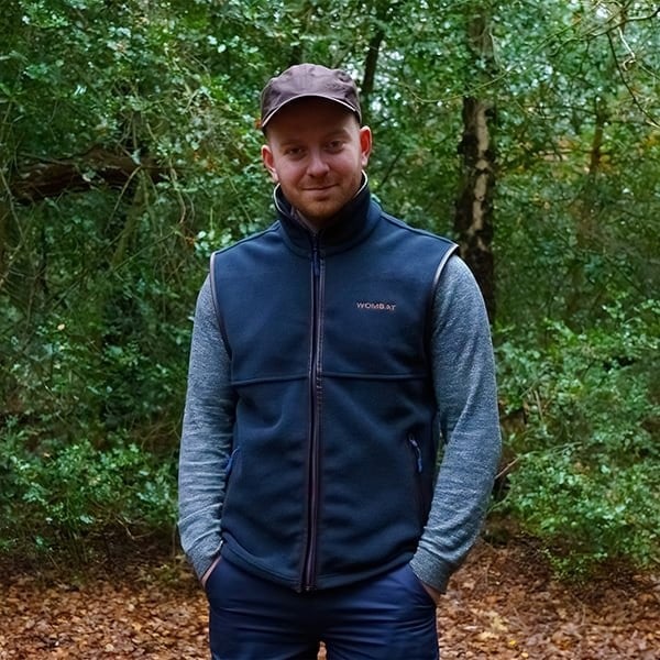 man wearing a wombat navy outdoor gilet