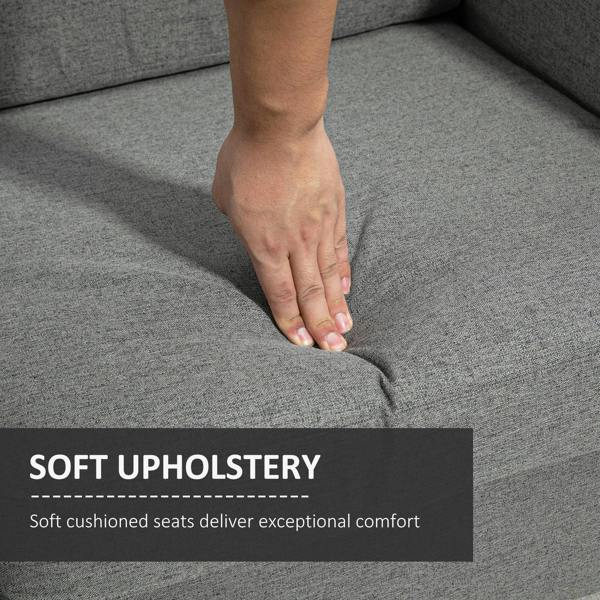 Grey upholstered seat cushion with hand pressing fabric to show soft cushioning