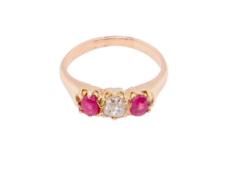 Vintage Tom A vintage three stone ruby and diamond ring