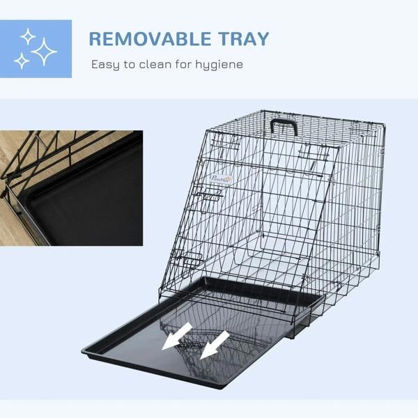 Black collapsible dog crate with removable tray shown being lifted out