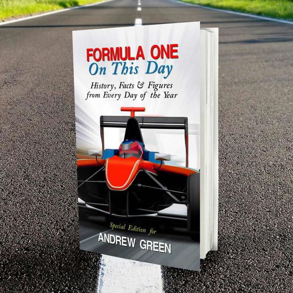 A personalised Formula One On This Day book printed with Andrew Green standing upright on an open asphalt racetrack road.