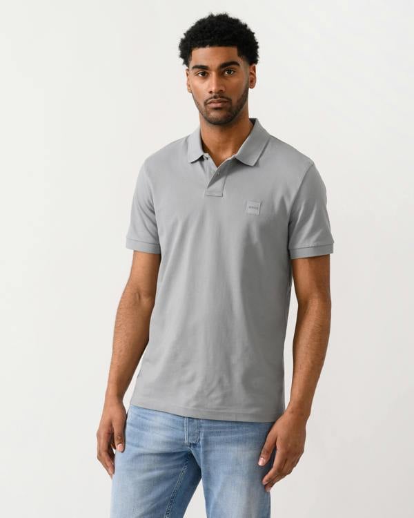 model wearing a BOSS Orange Passenger Mens Stretch-Cotton Slim-Fit Polo Shirt with Logo Patch in Silver 047