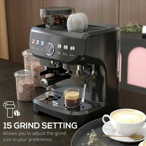 Black espresso coffee machine with steam wand and cup on drip tray