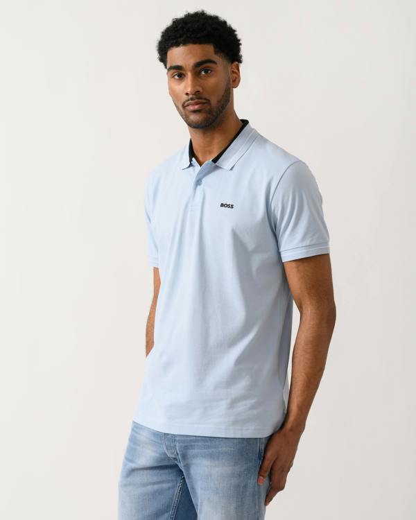 Model wearing a BOSS Green PL_Member Mens Short Sleeve Polo Shirt in Open Blue 460