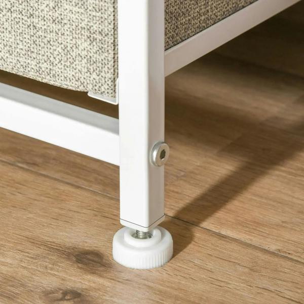 White adjustable foot with leveling base under metal frame of drawer chest