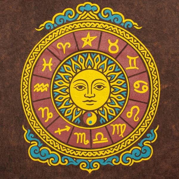 Sun zodiac emblem graphic with yellow face and colorful symbols on brown T-shirt