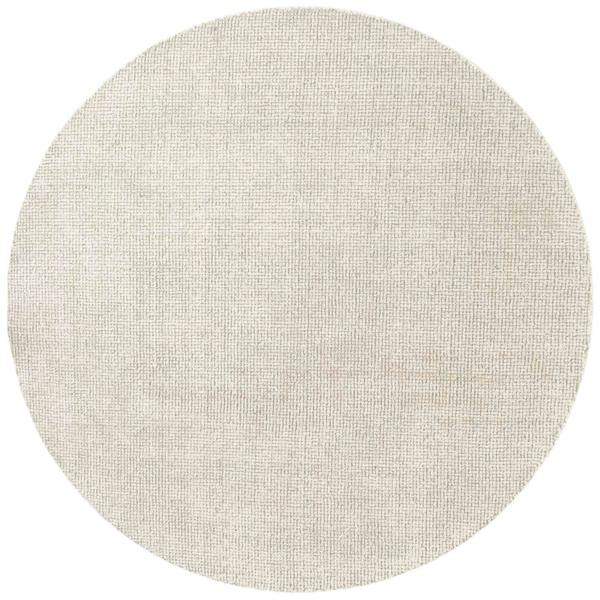 Round beige rug on a white background