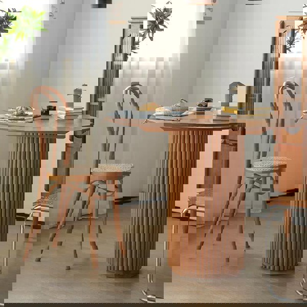 Cane Round Dining Table, Oak in a lifestyle setting with pool and dining table