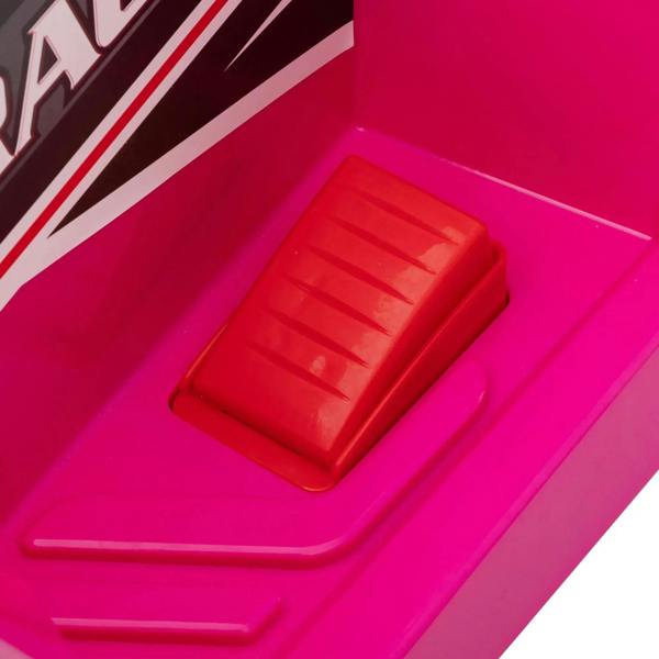 Red battery compartment cover on pink quad bike body, close-up
