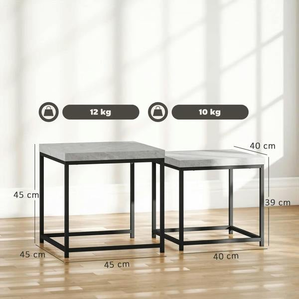 Two nesting square coffee tables with grey tops and black steel frames, side view