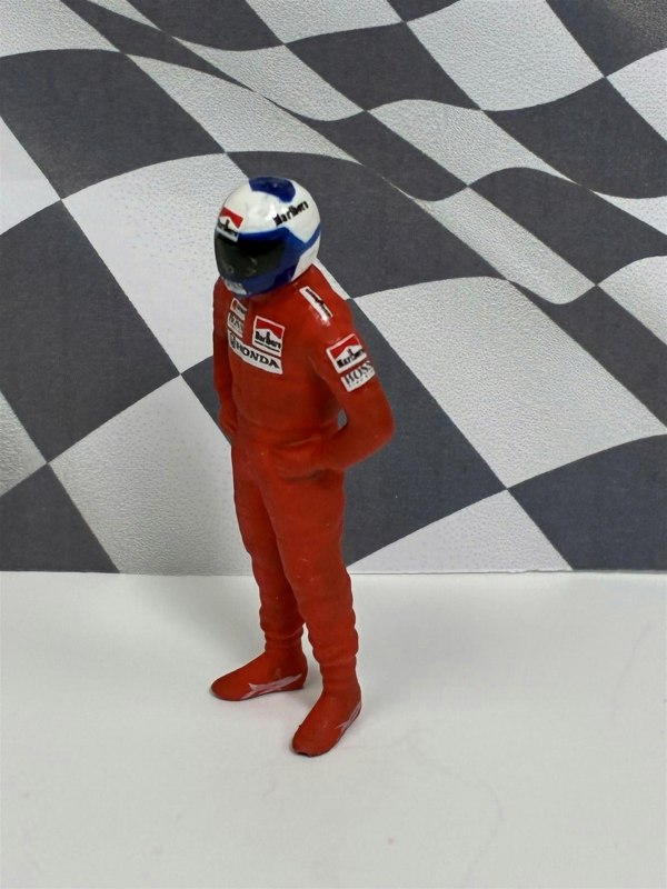 a toy figure in a red uniform