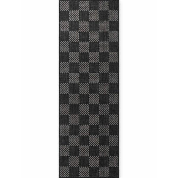 Black and gray checkered rug on a white background