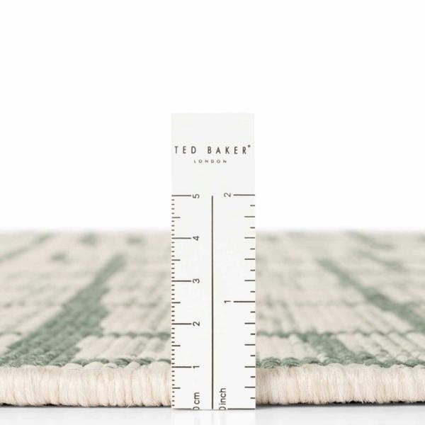 Ted Baker London rug with a ruler for scale on a white background