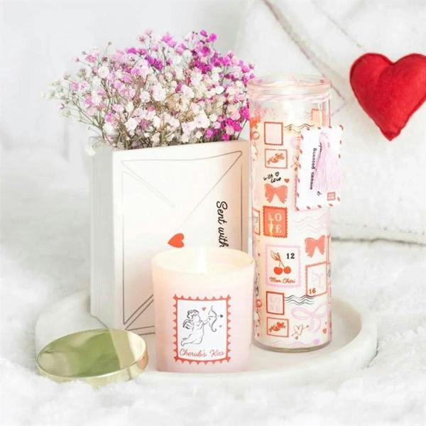 White envelope vase holding pink flowers; red heart and “Stay with me”