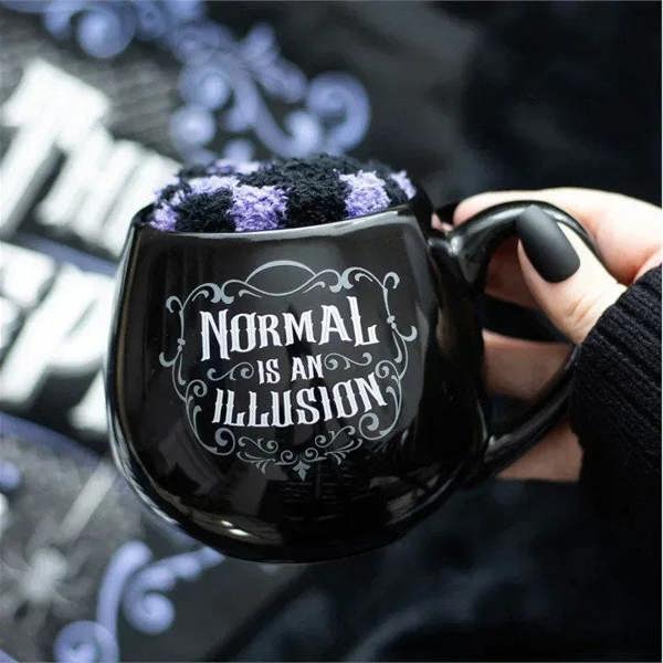 Black gothic mug with purple fuzzy top and 'Normal is an Illusion' print