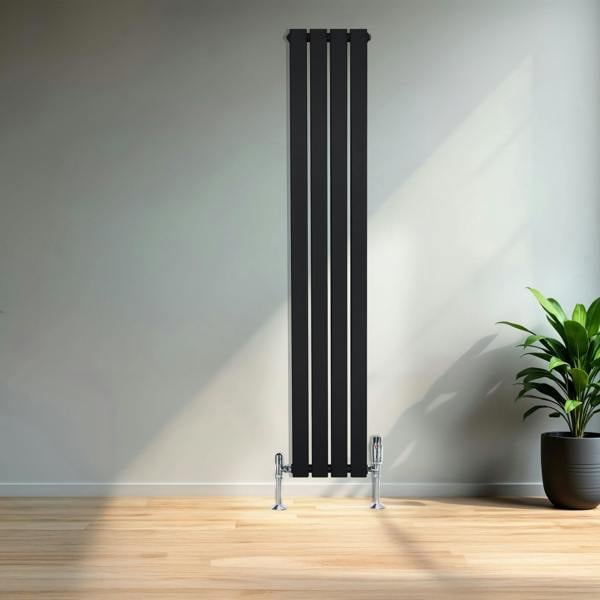 Flat black single column radiator, 1600 x 280mm, sleek vertical design with chrome feet, set against a modern interior with natural light