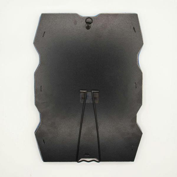 Back of dark chunky squiggly mirror with hanging bracket straps