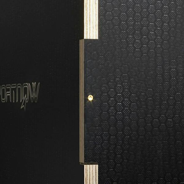 Black wooden jump box side panel close-up with reinforced corner and metal fastener