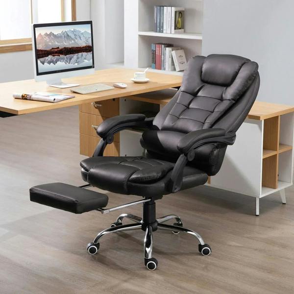 Executive office chair with retractable footrest, reclined seat, and dark PU leather