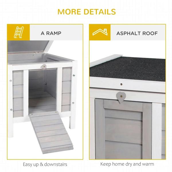 Grey wooden hutch featuring a ramp and asphalt-style roof for covered shelter