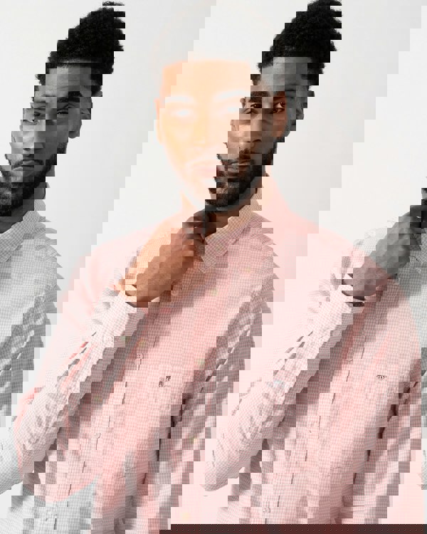 Detail shot of a Model wearing a GANT Mens Regular Fit Classic Poplin Gingham Shirt in Washed Pink