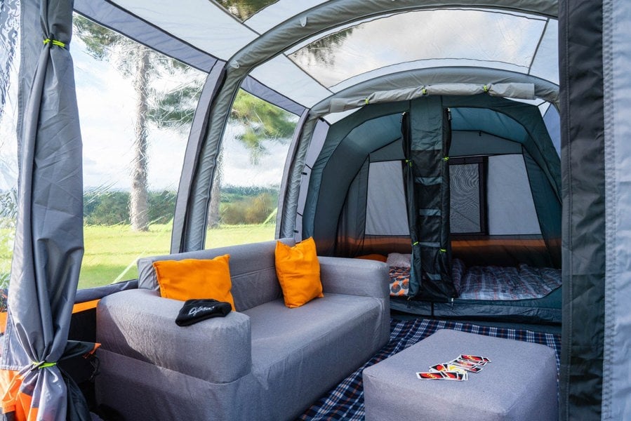 The inside of the Blakedown Breeze 4 Berth Inflatable Tent from OLPRO showing an inflatable sofa and the bedroom pod.