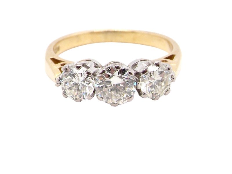 A three stone diamond trilogy ring