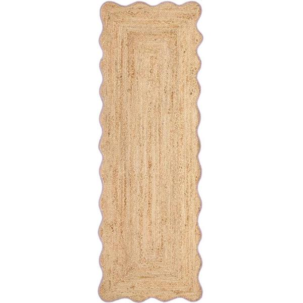 Beige braided rug on a white background
