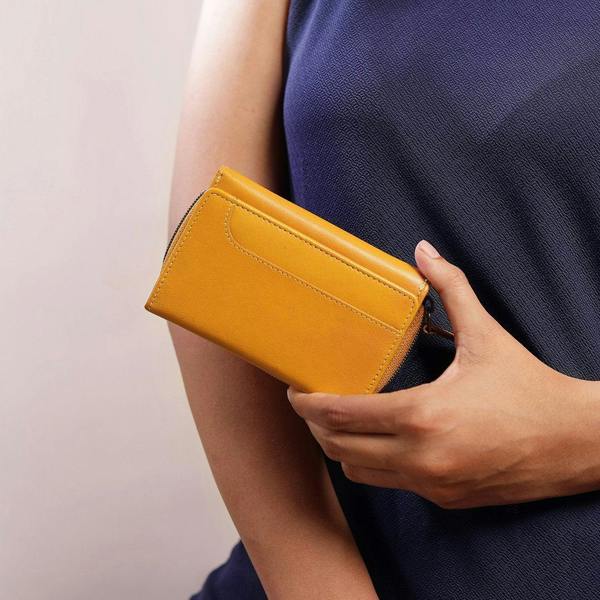 Person holding Yellow Leather Purse For Women Velura