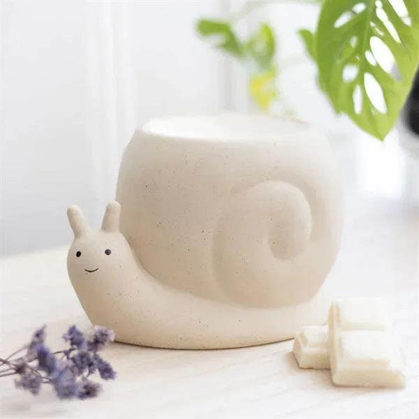 Snail oil burner with cream ceramic snail figurine and candle cavity