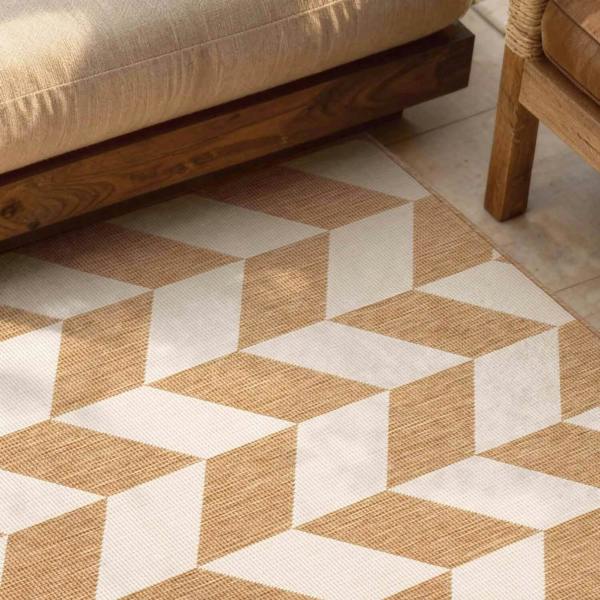 Geometric patterned rug with brown and beige colors on a wooden floor.